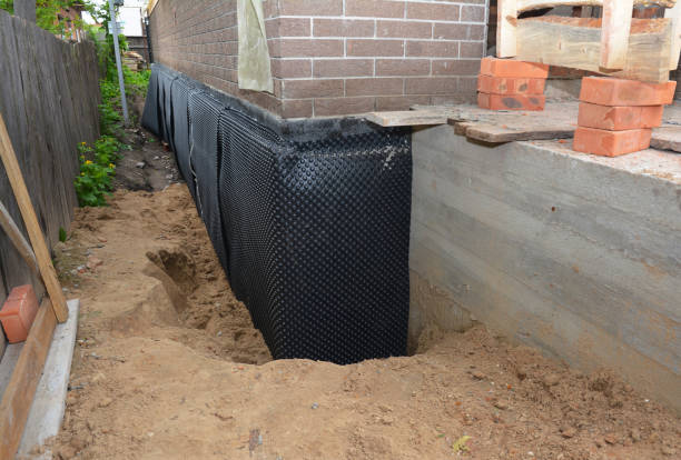 SJ Waterproofing Pros technician performing targeted Emergency Waterproofing assessment in Kennard, IN